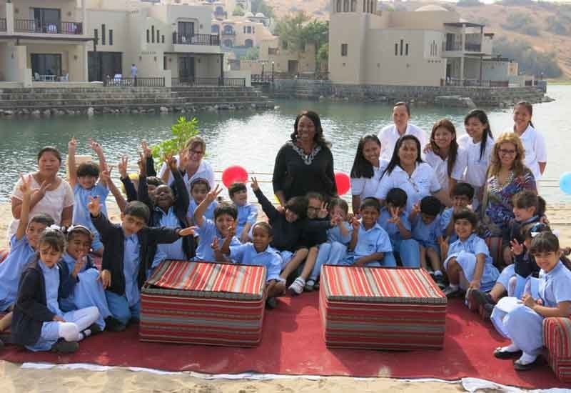 Students with the Cove Rotana team. Students with the Cove Rotana team.
