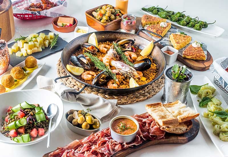 A spread of traditional Spanish dishes at El Sur. A spread of traditional Spanish dishes at El Sur.