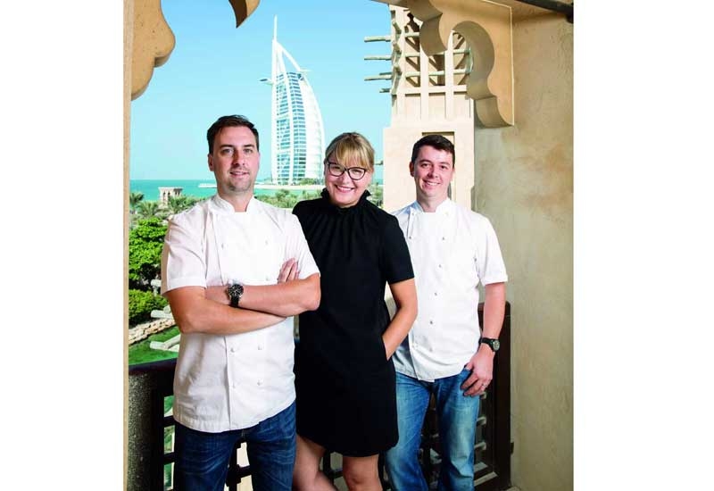 Nick Alvis, Viktorija Paplauskiene and Scott Price on Folly's terrace, overlooking the Burj Al Arab. Nick Alvis, Viktorija Paplauskiene and Scott Price on Folly's terrace, overlooking the Burj Al Arab.