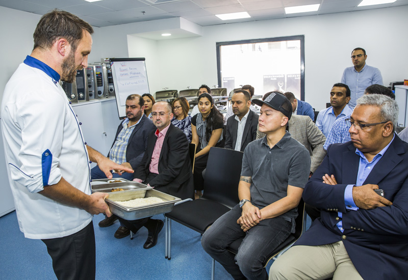 Sascha Barby shows his audience the quality of the food produced in a Rational combi-steamer. Sascha Barby shows his audience the quality of the food produced in a Rational combi-steamer.