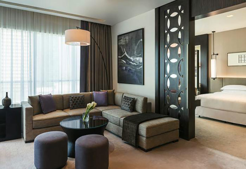 The deluxe suite offers a separate living area and bedroom. The deluxe suite offers a separate living area and bedroom.