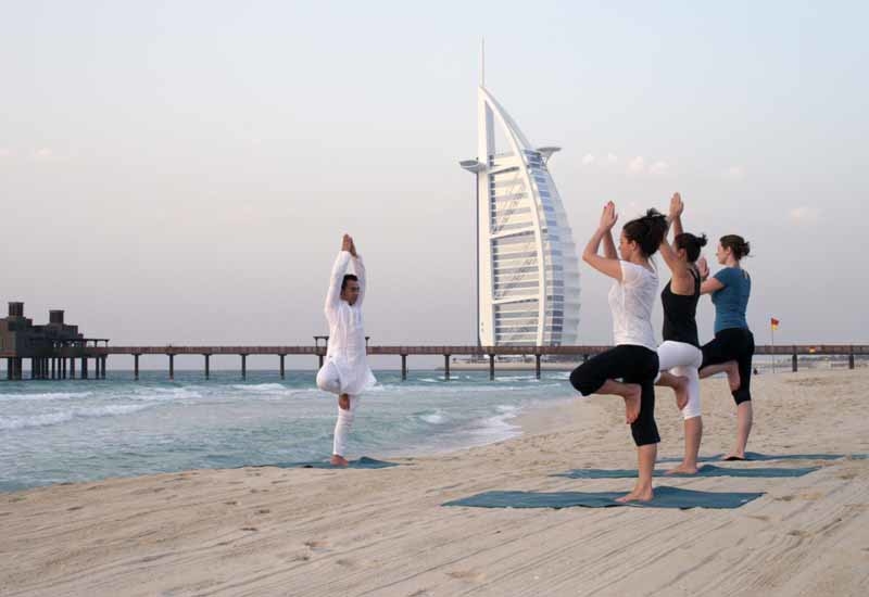 A complimentary yoga session on Madinat Jumeirah's private beach will be offered. A complimentary yoga session on Madinat Jumeirah's private beach will be offered.