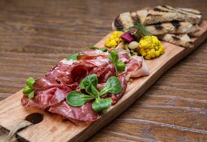Assorted beef cold cuts, grilled sourdough, homemade pickles. Assorted beef cold cuts, grilled sourdough, homemade pickles.