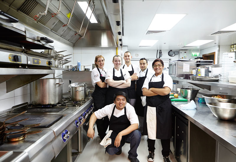 left to right: chef de partie Megan; head chef Amy Tomkinson; sous chef Andreas; commis chef Ankit; commis chef Gloria; chef de partie Panda. left to right: chef de partie Megan; head chef Amy Tomkinson; sous chef Andreas; commis chef Ankit; commis chef Gloria; chef de partie Panda.