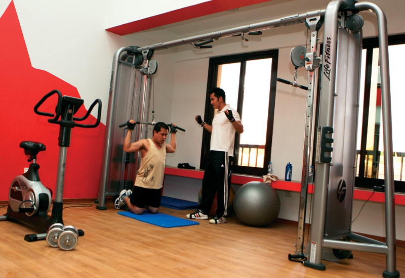 Staff at IHG Dubai Festival City's housing complex, The Oasis at Silicon Oasis, spend time in the gym. Staff at IHG Dubai Festival City's housing complex, The Oasis at Silicon Oasis, spend time in the gym.