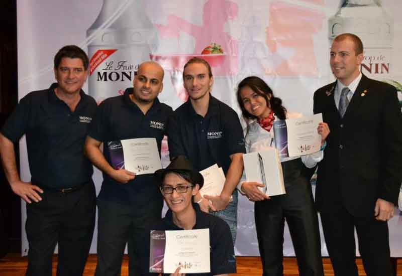 Monin's Jeremy Coulbeck (left) and Andrea Fidora (right) pose with contestants Monin's Jeremy Coulbeck (left) and Andrea Fidora (right) pose with contestants