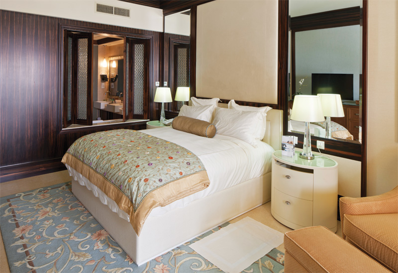 A completed guest room: the dark veneer is offset by the light-coloured linen and accessories. A completed guest room: the dark veneer is offset by the light-coloured linen and accessories.