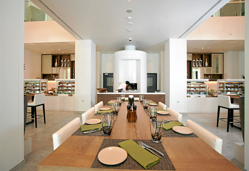 The 3 in 1 restaurant features dark wood and earthy tones. The 3 in 1 restaurant features dark wood and earthy tones.