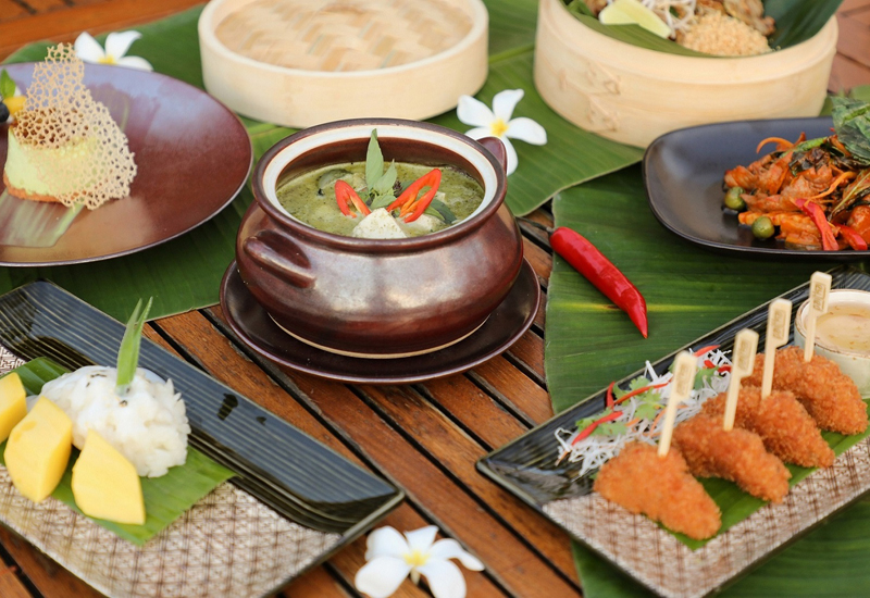 Dishes include green chicken curry with Thai eggplant and Thai basil Dishes include green chicken curry with Thai eggplant and Thai basil