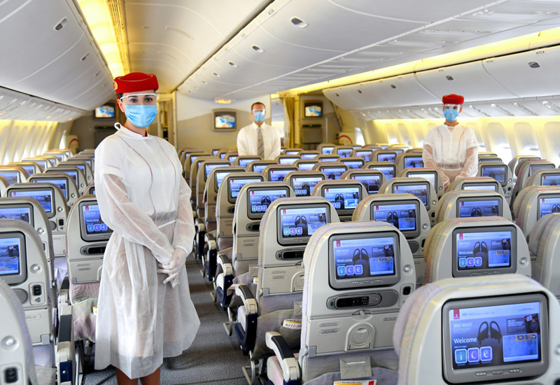 Emirates Airline crew in the mandatory protective equipment Emirates Airline crew in the mandatory protective equipment